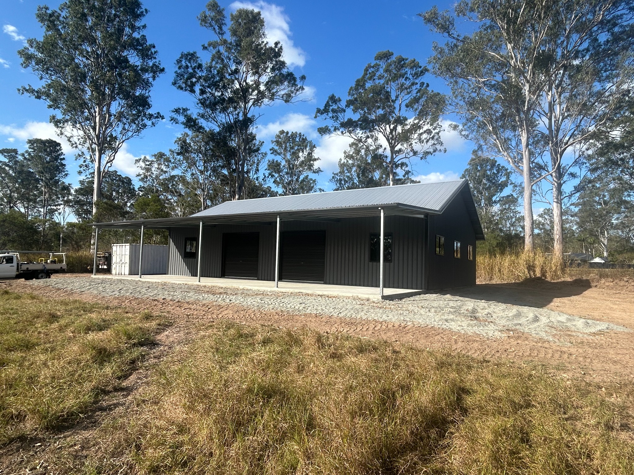 Charcoal acreage garage with a full-length verandah
