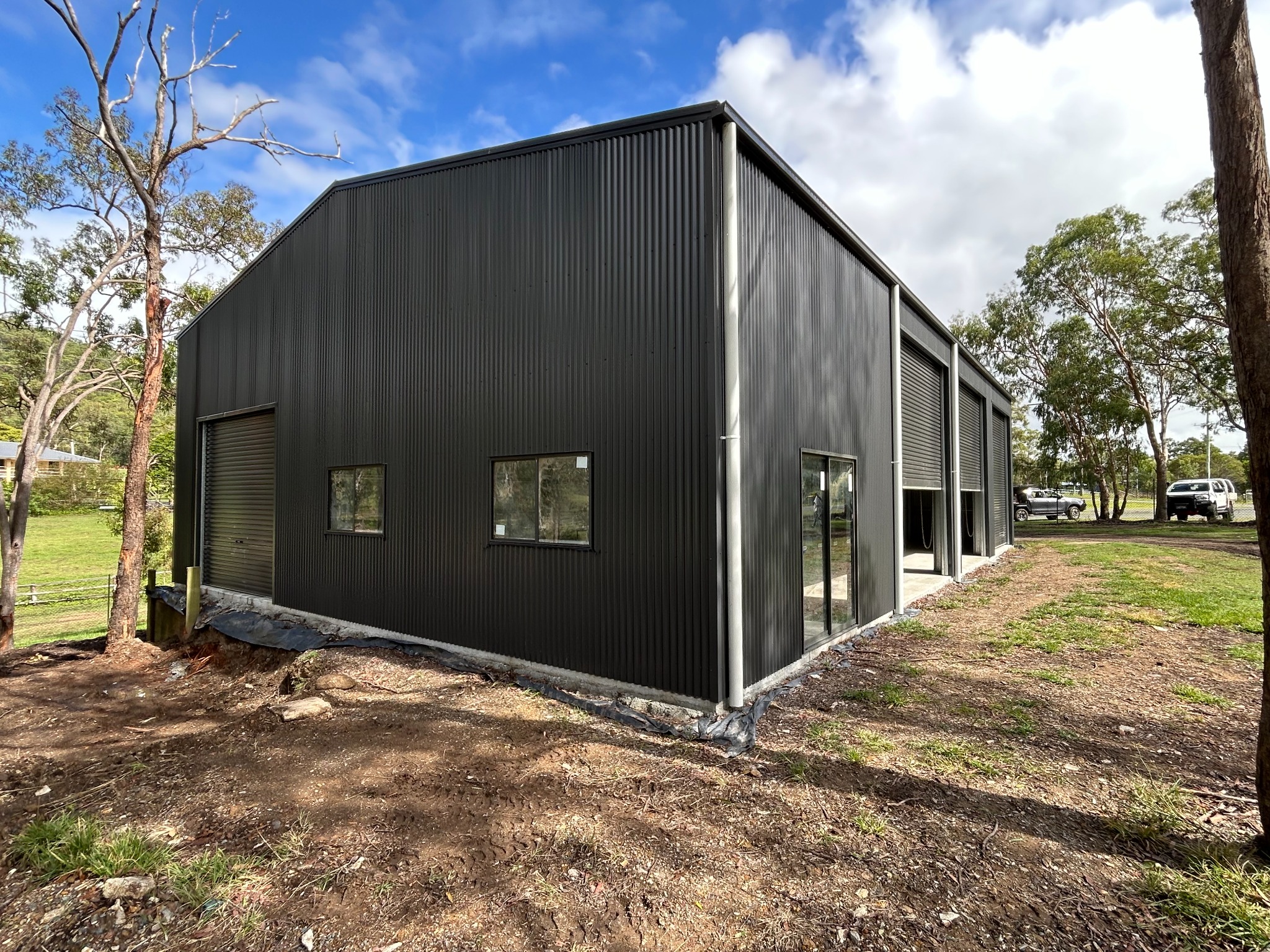 Premium charcoal steel workshop with roller doors